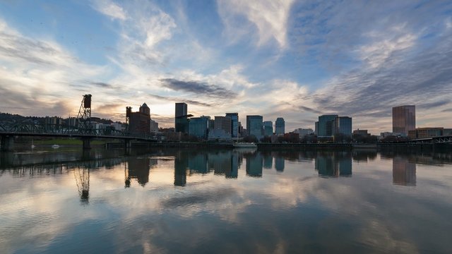UHD 4k Timelapse Movie of Clouds Movement and Water Reflection along Willamette River with Downtown City Skyline and Hawthorne Bridge in Portland Oregon 4096x2304