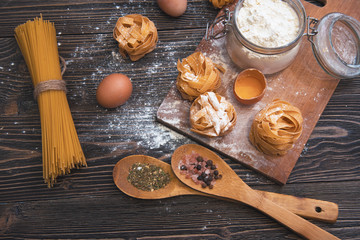 still life with raw homemade pasta and ingredients for pasta.till life with raw homemade pasta and...
