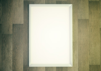 Blank white picture frame on wooden wall, mock up