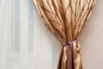beautiful golden curtain in the bedroom interior