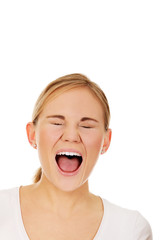 Stressed or angry young woman screaming