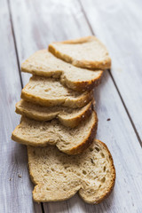 Sliced bread on wooden table