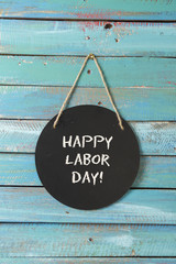 Labor Day chalk sign on blue wood background