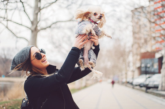 Young Caucasian Cute Girl Portrait With Dog Outdoor In Park Walking Happy And Smile All The Way
