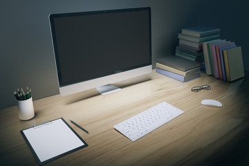Blank computer screen with keyboard, blank paper, books and eyeg