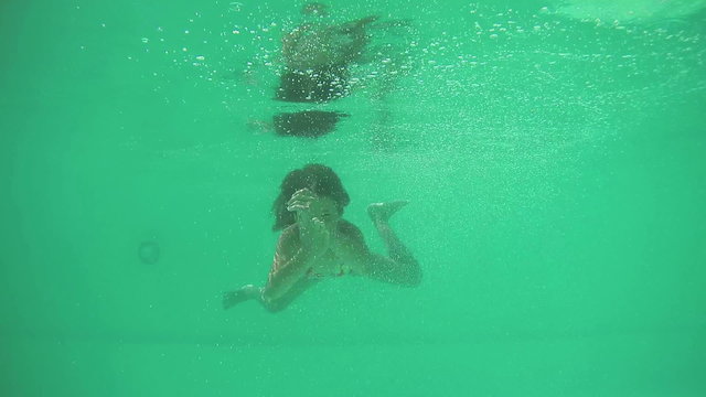 Girl diving in swimming pool