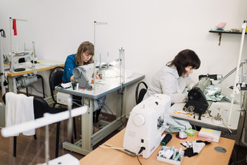 tailors work in the shop for the production of clothing