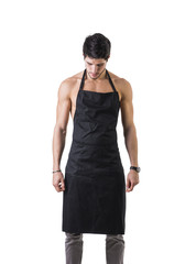 Fototapeta premium Young sexy shirtless chef or waiter wearing only apron