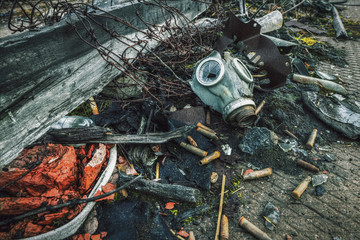 After a nuclear war.The old gas mask and ammunition among the ruins