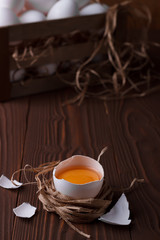 White eggs on brown wooden background