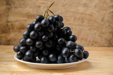 Seedless grape on wooden background