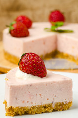 Homemade strawberry cheesecake  on white plate
