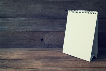 Blank desktop calendar on vintage old wood table