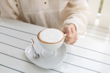photography with cappuccino near the window on the mornin