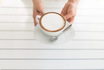 photography with cappuccino near the window on the mornin