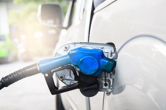 Refill Fuel To A Car At Gas Station.