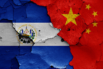 flags of El Salvador and China painted on cracked wall