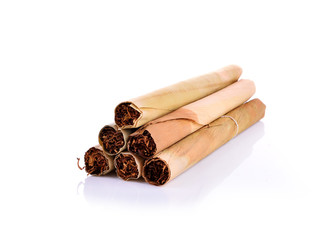 Tobacco pile and cigarette on white background