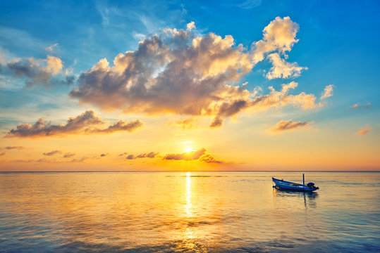 Fototapeta Colorful sunrise over ocean on Maldives