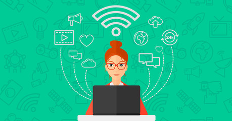 Woman working on laptop.