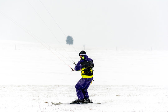 Man kite skiing