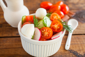 vegetable salad in a bowl on a table, selective focus