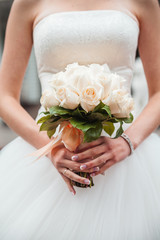 Obraz na płótnie Canvas Bride with wedding bouqet closeup shot