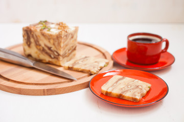 creamy fondant with a shredded nut on a plate, selective focus