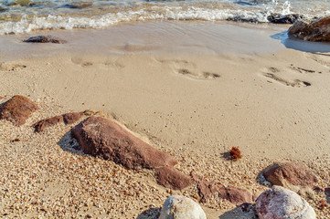 Footstep rock and sea with beach walk