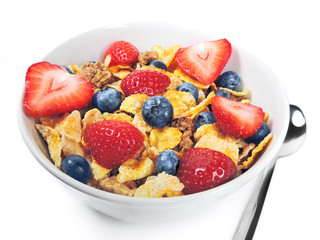 Breakfast bowl with cereals and fresh fruits, isolated on white.