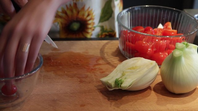preparing fresh vegetables, cut fennel and cherry tomatoes

