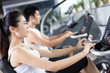 Fototapeta premium young people working out in modern gym