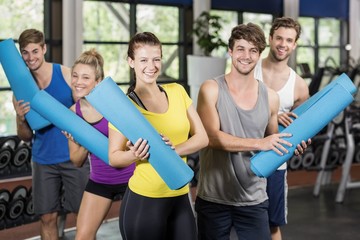 Group of people with fitness mat