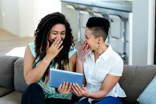 Lesbian Couple Using Digital Tablet