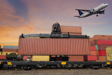 forklift handling and train and air plan with container in shipyard for Logistic Import Export background at sunset