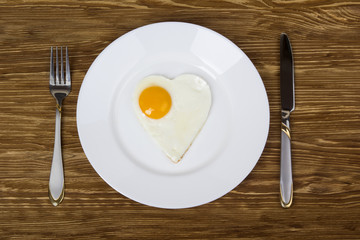  breakfast with scrambled eggs in  heart-shaped Valentine's Day