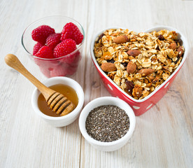 healthy snack - granola on wooden surface