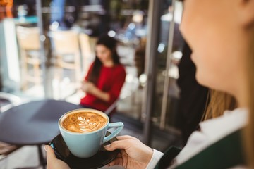 Waitress serving a cup of coffee
