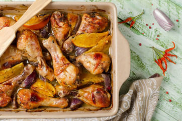 Oven-roasted orange chicken with red onion