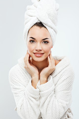 Gorgeous girl with dark hair wearing bath robe and towel