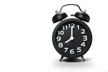 Black alarm clock  on white background