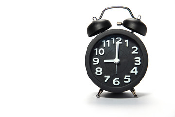 Black alarm clock  on white background