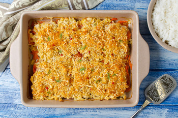 Oven-roasted fish fillet with carrots under a bread crust