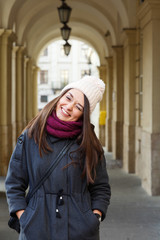 Charming brunette woman posing on the street