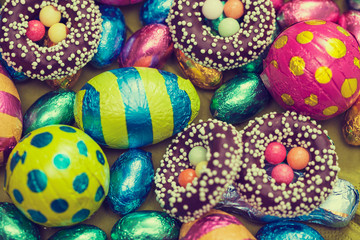 Decorative easter eggs on hand-painted  background