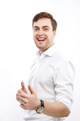 Young positive man posing with raised finger and laughing