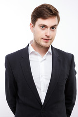 Handsome young man posing on white background, in studio