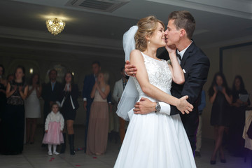 Fototapeta premium the first dance of gentle stylish happy blonde bride and groom