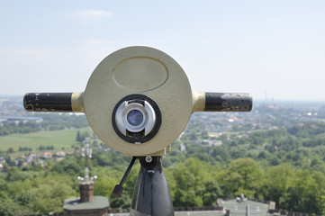 View of the city of Krakow (Poland) and a coin operated telescope on bright sunny day