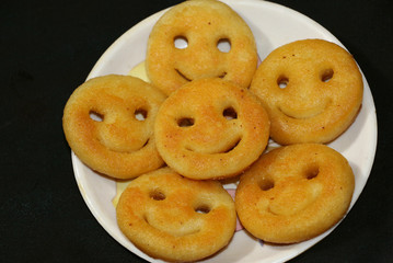 Naklejka premium Aloo Tikki or Fried Potato Patties; a popular Indian snack served with tomato and chilli sauce.